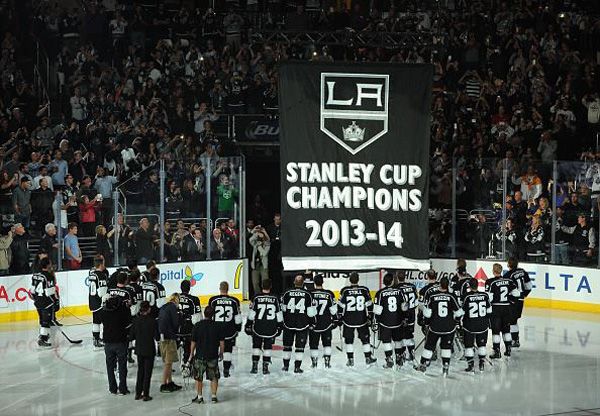 The L.A. Kings and their fans watch as the 2014 Stanley Cup championship banner is raised towards the rafters at STAPLES Center, on October 8, 2014.
