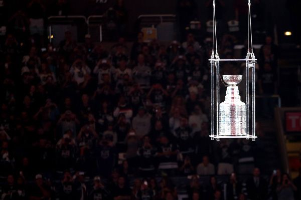 The crowd watches as the Stanley Cup is lowered towards the ice during the L.A. Kings' opening game ceremony at STAPLES Center, on October 8, 2014.