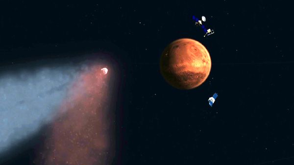 An illustration of NASA's Mars Reconnaissance Orbiter and MAVEN spacecraft, as well as Europe's Mars Express probe, orbiting the Red Planet as comet Siding Spring passes by.