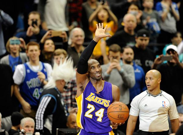 Kobe Bryant waves to the Minnesota crowd after making a free throw that helped him surpass Michael Jordan on the NBA's all-time scoring list...on December 14, 2014.
