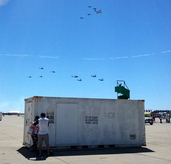 A fleet of Marine Corps aircraft fly over the main airfield at MCAS Miramar after a combat demo...on September 24, 2016.