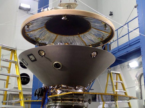 The heat shield is about to be attached to the aeroshell that enshrouds NASA's InSight Mars lander at the Lockheed Martin facility near Denver, Colorado.