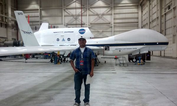 Posing with an RQ-4 Global Hawk drone inside a hangar at NASA's Armstrong Flight Research Center in Edwards Air Force Base...on May 31, 2016.