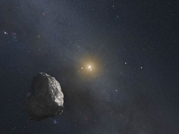 An artist's concept of a Kuiper Belt Object with the distant Sun and the outer planets in the background.