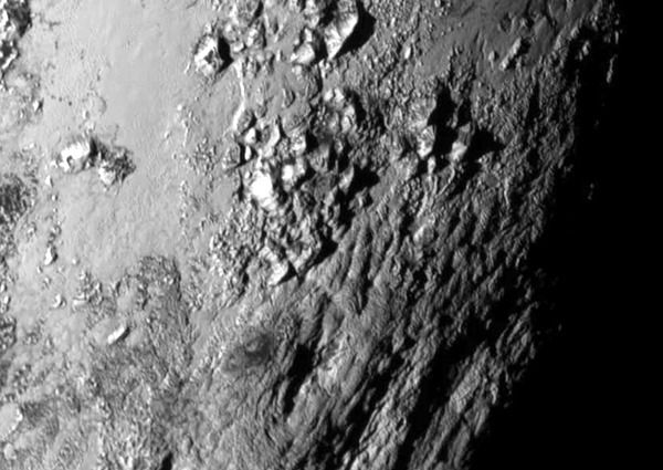 A close-up image of huge mountains composed of water ice on the surface of Pluto...as seen by NASA's New Horizons spacecraft on July 14, 2015.