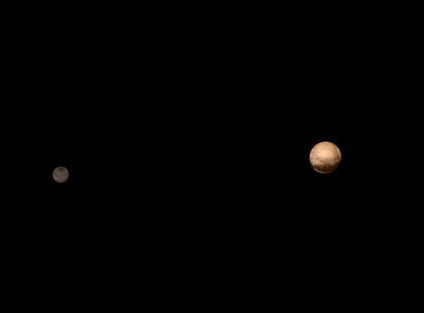 An image of Pluto (right) and Charon (left) that was taken by NASA's New Horizons spacecraft from a distance of 3.7 million miles (6 million kilometers) on July 8, 2015.