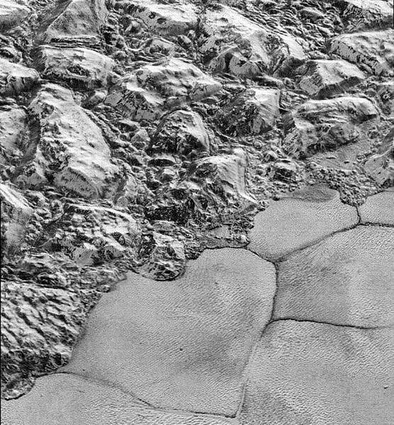 A high-resolution image of the al-Idrisi mountains at Pluto's Sputnik Planum region...taken by NASA's New Horizons spacecraft on July 14, 2015.