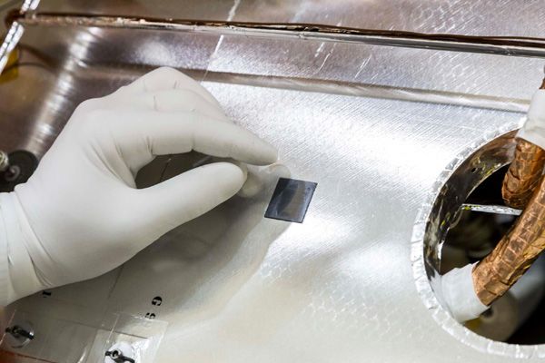 A microchip bearing the names of 440,000 people (including Yours Truly) is attached to the OSIRIS-REx spacecraft at the Lockheed Martin facility near Denver, Colorado.