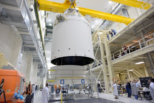 The Orion EFT-1 capsule is about to be attached to the stage adapter ring that will connect the spacecraft to a Delta IV Heavy rocket...which will launch Orion on EFT-1 this December. The Orion EFT-1 capsule is about to be attached to the stage adapter ring that will connect the spacecraft to a Delta IV Heavy rocket...which will launch Orion on EFT-1 this December.