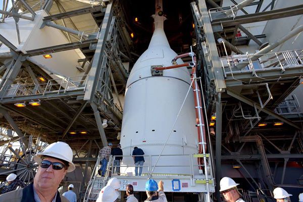 Engineers prepare to lift the Orion EFT-1 spacecraft up the Space Launch Complex 37 gantry to be mated with its Delta IV Heavy rocket at Cape Canaveral Air Force Station in Florida...on November 12, 2014. Engineers prepare to lift the Orion EFT-1 spacecraft up the Space Launch Complex 37 gantry to be mated with its Delta IV Heavy rocket at Cape Canaveral Air Force Station in Florida...on November 12, 2014.