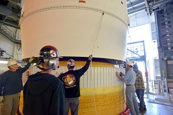 Engineers make sure that the Orion EFT-1 spacecraft is properly aligned with its Delta IV Heavy launch vehicle for mating at Cape Canaveral Air Force Station in Florida...on November 12, 2014. Engineers make sure that the Orion EFT-1 spacecraft is properly aligned with its Delta IV Heavy launch vehicle for mating at Cape Canaveral Air Force Station in Florida...on November 12, 2014.