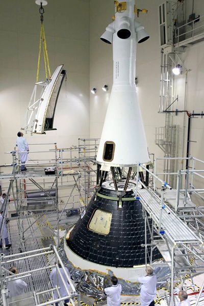 The four ogive panels of the Launch Abort System are about to be attached to the Orion EFT-1 capsule at NASA's Kennedy Space Center in Florida...on October 14, 2014. The four ogive panels of the Launch Abort System are about to be attached to the Orion EFT-1 capsule at NASA's Kennedy Space Center in Florida...on October 14, 2014.
