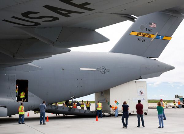 At Buckley Air Force Base in Colorado, a container carrying NASA's OSIRIS-REx spacecraft is about to be loaded onto a U.S. Air Force C-17 cargo plane for a flight to NASA's Kennedy Space Center in Florida...on May 20, 2016.