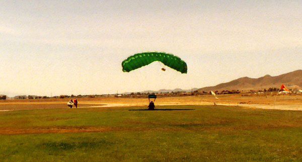 Touching down at the drop zone after doing a tandem skydive above Perris Valley, California...on May 28, 2006.