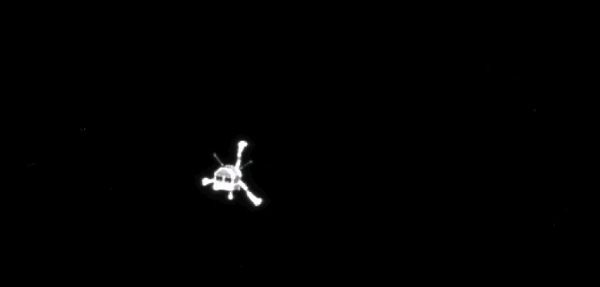 Philae floats in the darkness of space after being deployed by the European Space Agency's (ESA) Rosetta orbiter for a 7-hour journey to comet 67P/Churyumov–Gerasimenko's surface, on November 12, 2014.