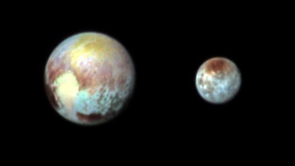 A false-color image of Pluto and Charon that was taken by NASA's New Horizons spacecraft on July 13, 2015.
