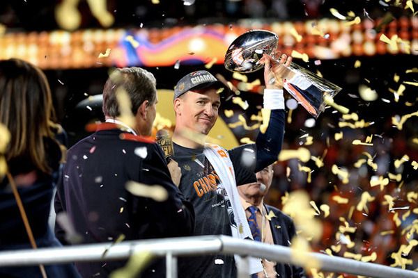 Peyton Manning hoists the Vince Lombardi Trophy after his Denver Broncos defeat the Carolina Panthers, 24-10, in Super Bowl 50...on February 7, 2016.