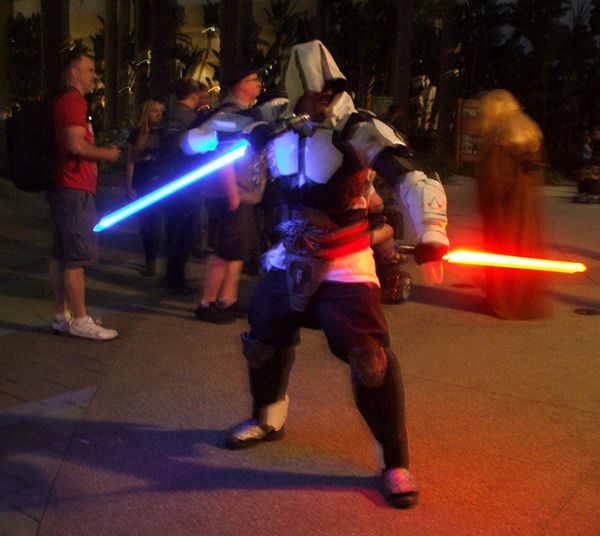 A lightsaber-welding assassin from ASSASSIN'S CREED poses for photos at the Star Wars Celebration in Anaheim, California...on April 17, 2015.