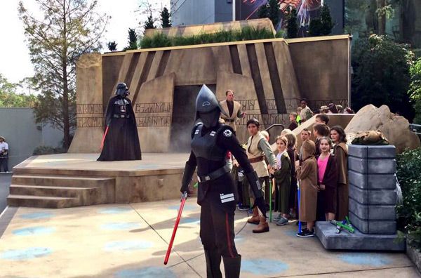 Disneyland Cast Members dressed as Darth Vader and the Seventh Sister.