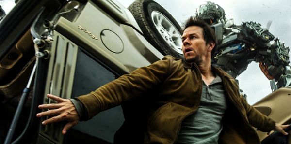 Cade Yeager hides behind a damaged vehicle as Lockdown approaches in TRANSFORMERS: AGE OF EXTINCTION. Cade Yeager hides behind a damaged vehicle as Lockdown approaches in TRANSFORMERS: AGE OF EXTINCTION.