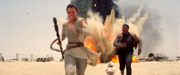 Rey (Daisy Ridley), Finn (John Boyega) and BB-8 flee from a marauding TIE Fighter (upper-left) in STAR WARS: THE FORCE AWAKENS. Rey (Daisy Ridley), Finn (John Boyega) and BB-8 flee from a marauding TIE Fighter (upper-left) in STAR WARS: THE FORCE AWAKENS.