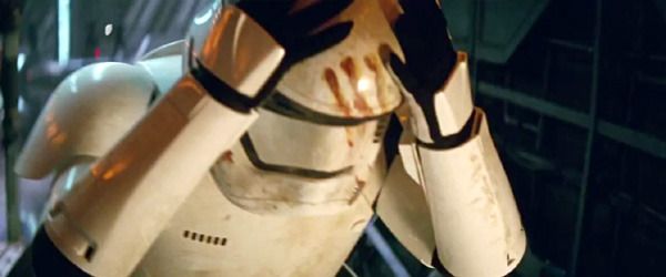 Finn is about to remove his bloodied Stormtrooper helmet in STAR WARS: THE FORCE AWAKENS. Finn is about to remove his bloodied Stormtrooper helmet in STAR WARS: THE FORCE AWAKENS.