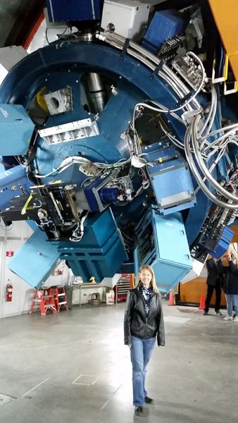 Dr. Susan Lederer of NASA's Johnson Space Center poses next to the UKIRT Telescope, which was used to confirm the existence of the three TRAPPIST-1 exoplanets, at Mauna Kea in Hawaii.