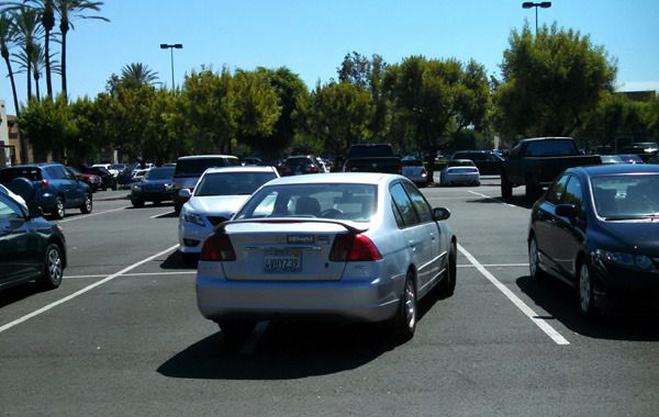 I really DO hope that someone keyed the side of that silver Honda Civic at the center of this photo... Moron.