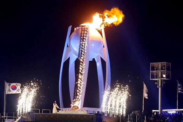 Former figure skater Yuna Kim lights the torch during the opening ceremony of the 2018 Winter Olympic Games in PyeongChang, South Korea...on February 9, 2018.