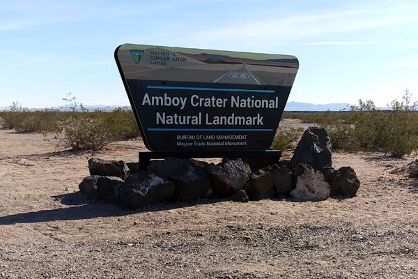 The sign that welcomes drivers after they merge onto the road leading into Amboy Crater National Natural Landmark from the historic highway Route 66...on December 2, 2018.