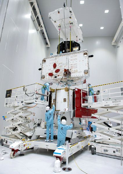 Japan's MIO and Europe's MPO spacecraft, now joined together, are about to be positioned atop Europe's Mercury Transfer Module for a 'fit check' at Europe's Spaceport in Kourou, French Guiana.