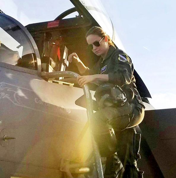 Brie Larson, who plays Carol Danvers in CAPTAIN MARVEL, poses near the cockpit of an F-15 Eagle fighter jet at Nellis Air Force Base in Nevada. Brie Larson, who plays Carol Danvers in CAPTAIN MARVEL, poses near the cockpit of an F-15 Eagle fighter jet at Nellis Air Force Base in Nevada.