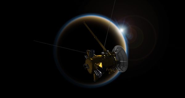 An artist's concept of NASA's Cassini spacecraft making one last flyby of Saturn's moon Titan on September 11, 2017.