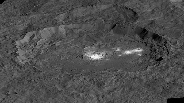 A simulated view of Ceres' Occator Crater...with bright spots indicating salt-rich material in the crater's basin.