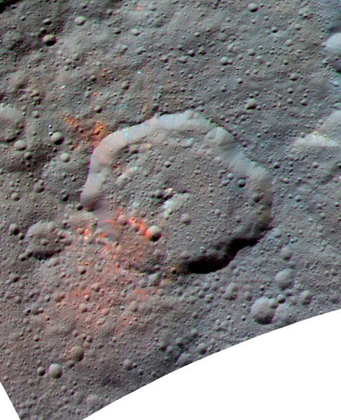 An enhanced image of dwarf planet Ceres...with organics data (shaded in red) taken by NASA's Dawn spacecraft overlaid on the celestial body.