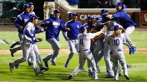 The Los Angeles Dodgers celebrate after defeating the Chicago Cubs, 11-1, in Game 5 of the National League Championship Series (NLCS)...on October 19, 2017.