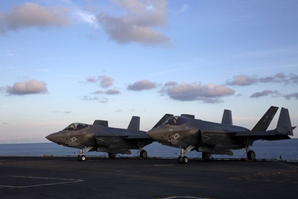 Two F-35C Lightning II aircraft sit on the flight deck of the USS Abraham Lincoln...on August 20, 2018.