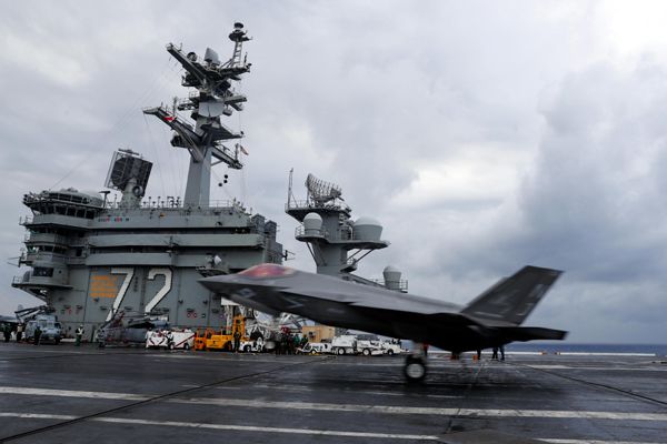 An F-35C Lightning II is about to touch down onto the deck of the nuclear-powered aircraft carrier USS Abraham Lincoln...on March 17, 2018.