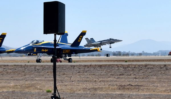 With a Blue Angel in the foreground, an F/A-18 Hornet prepares to land at MCAS Miramar in San Diego County, California...on September 29, 2018.