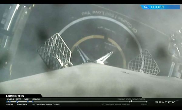 Landing legs are deployed on the Falcon 9's first stage booster after returning to Earth following the launch of NASA's TESS spacecraft on April 18, 2018...in this footage taken by an onboard camera.