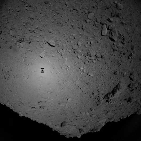 Hayabusa2's shadow is visible on the surface of Ryugu as the Japanese spacecraft descended towards the asteroid on September 21, 2018 (Japan Time).