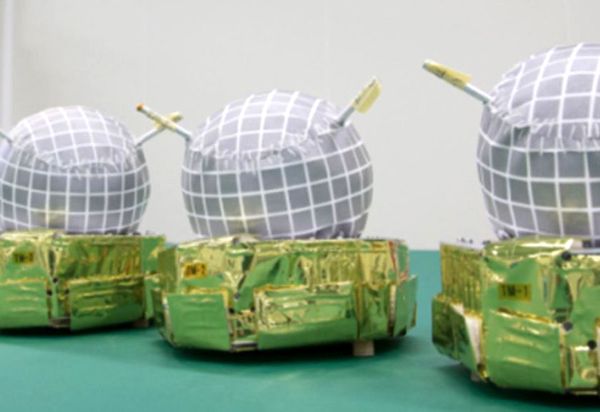A pre-launch snapshot of three of the five target markers that the Hayabusa2 spacecraft is equipped with for its mission at asteroid Ryugu.