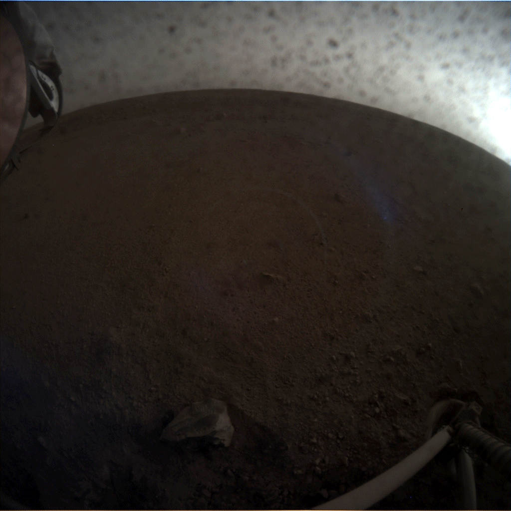 Another animated GIF comprised of images taken by NASA's InSight lander (using its Instrument Context Camera) as it placed the seismometer on the surface of Mars...on December 19, 2018.