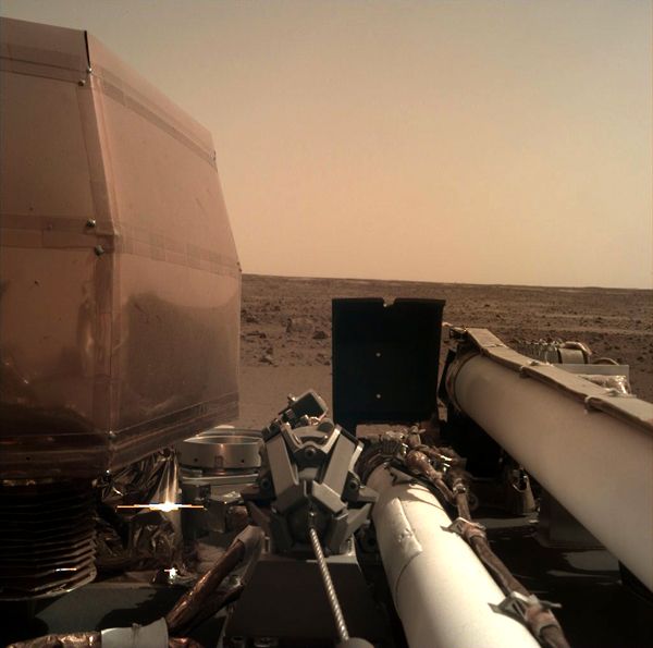 An image of the Martian surface that was taken by a camera mounted to the robotic arm aboard NASA's InSight lander...on November 26, 2018.