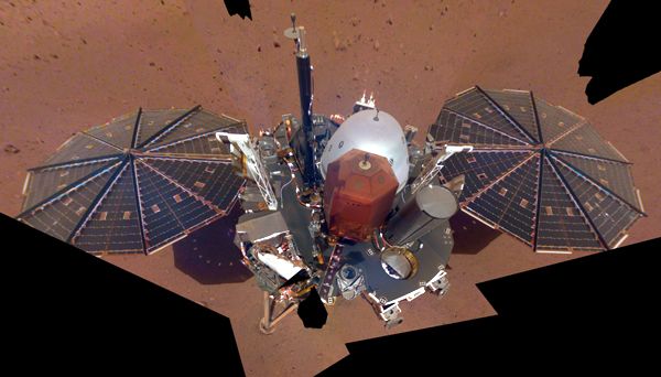 A selfie that NASA's InSight lander took (using the Instrument Deployment Camera on its robotic arm) on the Martian surface...on December 6, 2018.