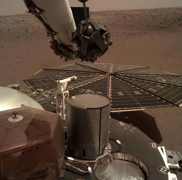One of InSight's twin solar panels and its flight deck are visible in this image taken by a camera on the spacecraft's robotic arm...on December 7, 2018.