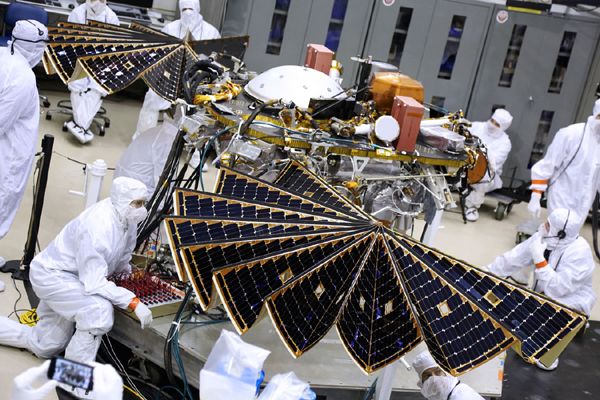 Engineers watch as NASA's InSight Mars lander deploys its twin solar arrays at the Lockheed Martin facility near Denver, Colorado...on January 23, 2018.
