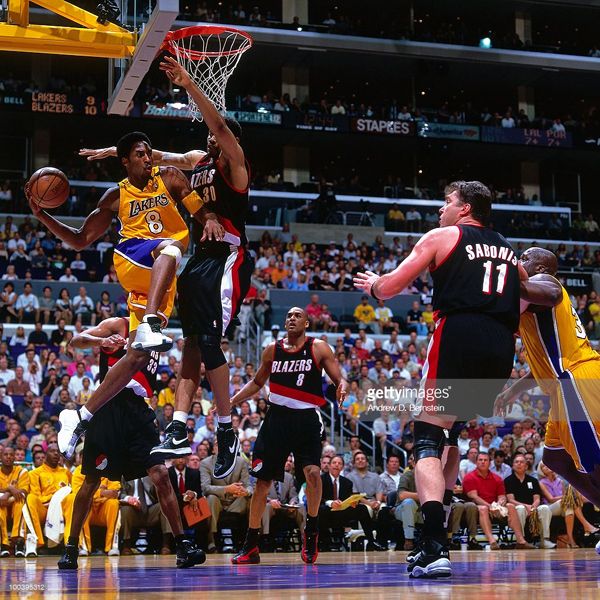 The L.A. Lakers' Kobe Bryant makes a play against the Portland Trailblazers' Rasheed Wallace in Game 7 of the Western Conference Finals...on June 4, 2000.