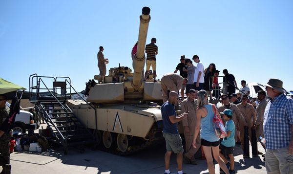 A crowd gathers around (and atop) an M1A1 Abrams on display at the Miramar Air Show...on September 29, 2018.