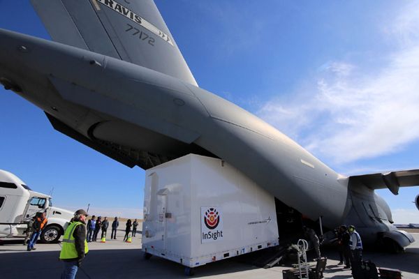 A shipping container holding NASA's InSight Mars lander is loaded onto a U.S. Air Force C-17 cargo plane for transport from Denver, Colorado to Vandenberg Air Force Base in California...on February 28, 2018.